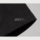 ONE Boxy Crop Black – sleeve logo detail