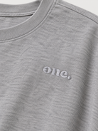 Studio Core Heather Gray — תקריב הרקמה ומרקם הבד